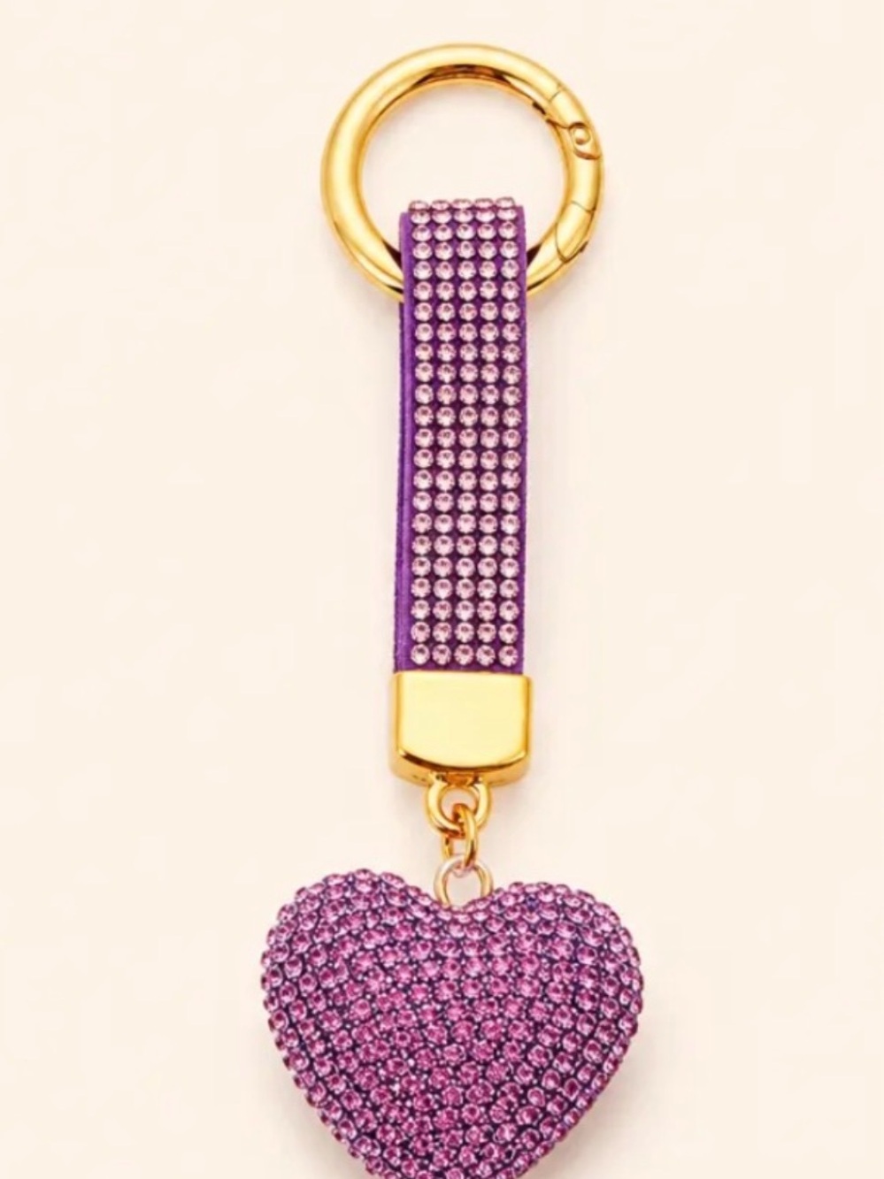 Sparkly pink rhinestone heart keychain with a matching bedazzled strap.